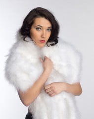 Beautiful girl in a fur shawl