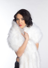 Beautiful girl in a fur shawl