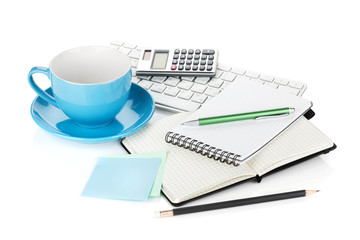 Blue coffee cup and office supplies