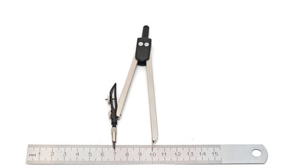 Metal measuring devices against a white background including rul