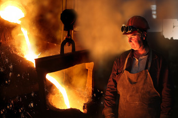 Hard work in a foundry, melting iron