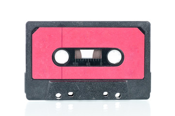 Cassette tape over a reflective white background