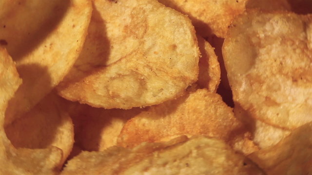 Potato chips in rotation. Macro