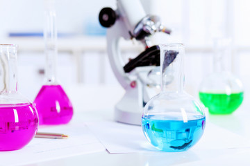 Chemistry laboratory glassware with colour liquids