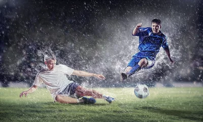 Foto op Plexiglas twee voetballers die de bal slaan © Sergey Nivens