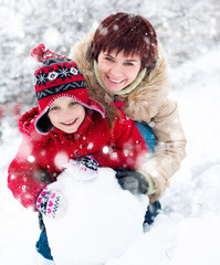 Happy family with snowman