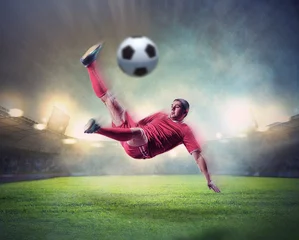 Papier Peint photo Lavable Foot joueur de football frappant le ballon
