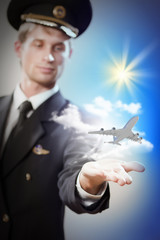 Image of pilot with plane in hand