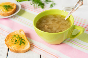 Onion soup in green bowl