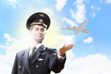 Obraz premium Image of pilot with plane in hand