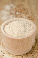 buckwheat flour in a wooden bowl