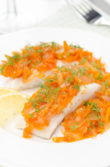 cod with pickled carrot and onion closeup