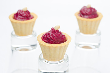 three tartlets with beetroot mousse with goat cheese horizontal