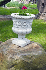 vintage vase with flower in park