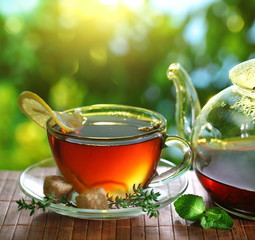 Cup of tea and teapot.