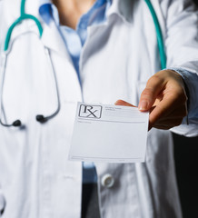 Closeup on medical doctor woman giving prescription 