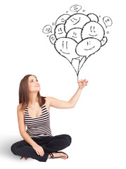 Happy woman holding balloons drawing