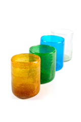 group of multi coloured glass cups on white background