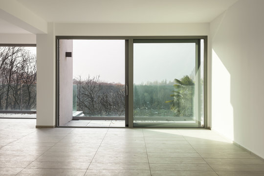 a space in a modern house, empty room with a big window