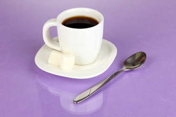 A cup of strong coffee on purple background