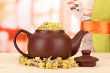 Dried herbs in teapot