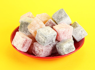rahat lokum in plat on yellow background