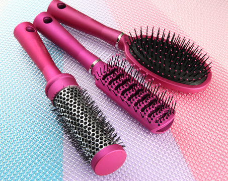 Comb brushes on bright background