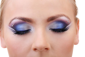 Beautiful female eyes with bright blue make-up