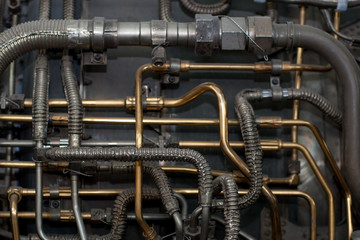 Industrial techno background of various complicated pipes from the aircraft jet engine