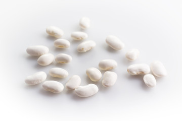 Fototapeta na wymiar White haricot beans on white background