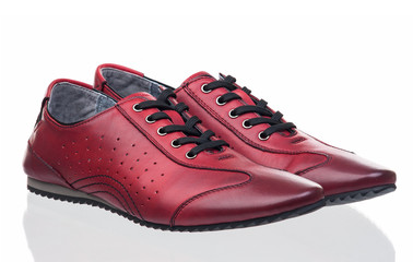 Red female shoes over white
