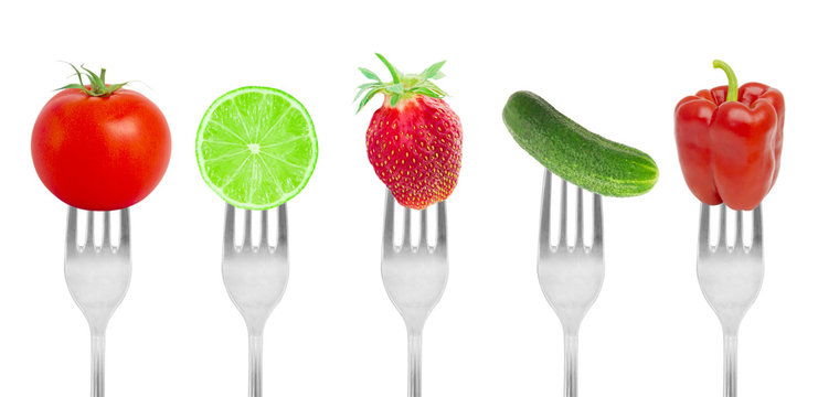 Diet concept, fruit and vegetables on forks