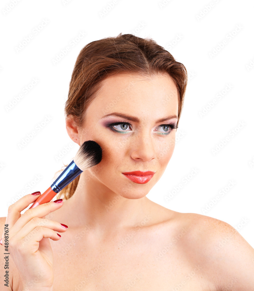 Wall mural portrait of beautiful woman with make-up brush for powder,