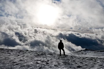 Fotobehang Man met bewolkte achtergrond © hraska