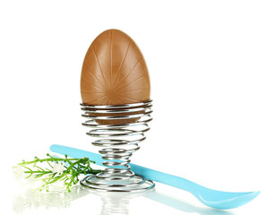 Chocolate egg in stand isolated on white