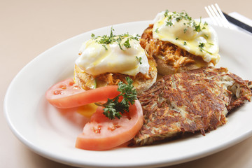 Smoked salmon eggs Benedict served with hash browns