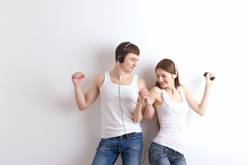 Fototapeta premium boy and girl listening of a music