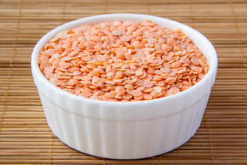 Red lentils in white ceramic cup