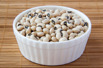 white beans in white ceramic cup