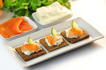 canapes rye bread with ricotta cheese and smoked salmon