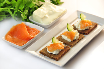 canapes rye bread with ricotta cheese and smoked salmon