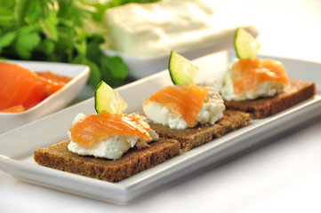 canapes rye bread with ricotta cheese and smoked salmon