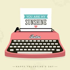 Vintage typewriter with happy valentine's day slogan