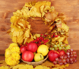 Autumnal composition with yellow leaves, apples and mushrooms