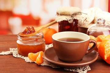 light breakfast with tea and homemade jam, on wooden table