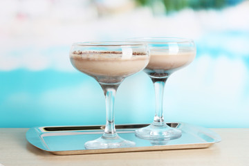 Cream cocktails on brightblue background