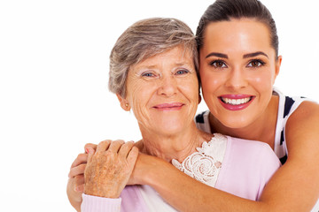 happy senior mother and adult daughter closeup portrait on white