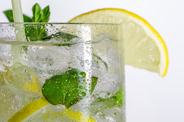 Closeup of lemon drink with ice cubes