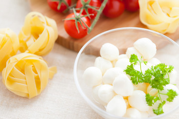 Raw fettuccine and mozzarella balls