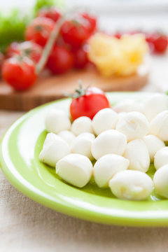 balls of mozzarella cheese and cherry tomatoes
